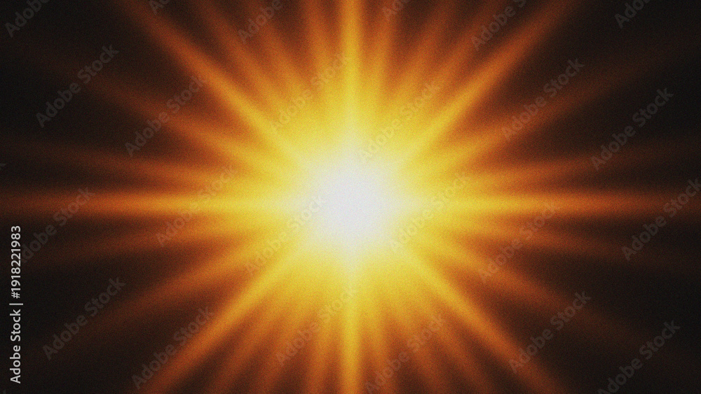Obraz premium Bright Sunburst Flare Effect with Radial Rays on Dark Background