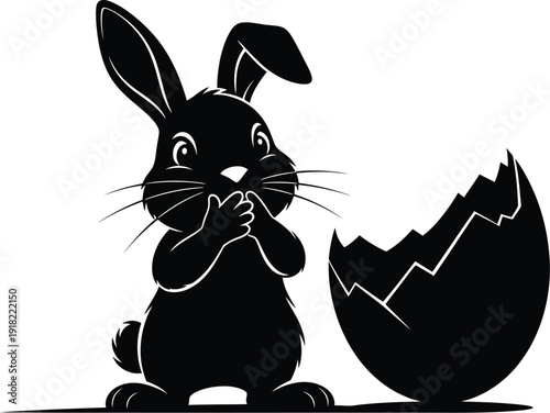 Cute rabbit emerging from broken eggshell in black silhouette