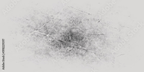 An abstract black and white grunge background features a cold winter texture of frost and ice with a rough surface pattern and a dirty splash of liquid paint on a textured wall