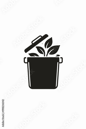 Modern pot with fresh green leaves growing inside