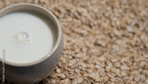 Oat Milk in Mug on Oat Flakes, Vegan Lactose Free Breakfast