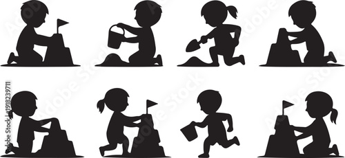 Silhouettes of young children joyfully playing in the sand building sandcastles on a sunny day