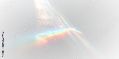 Blurred rainbow refraction drifts softly across black abstract surface. Prism colors shimmer in subtle streaks. Holographic overlay adds luminous dreamy glow.
