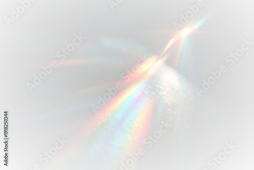Iridescent rainbow streaks blur softly across dark canvas. Prism reflections shimmer in vibrant multicolor light. Holographic overlay enhances dreamy magical effect.
