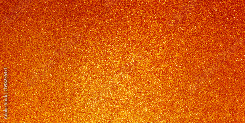 Shimmering orange gold glitter sparkling background