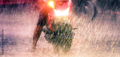 Juicy pictures for bikers. Traffic on the streets of the city (street bike, scooters and cars) during the tropical downpour, monsoon season. Java Island. Indonesia. Surabaya