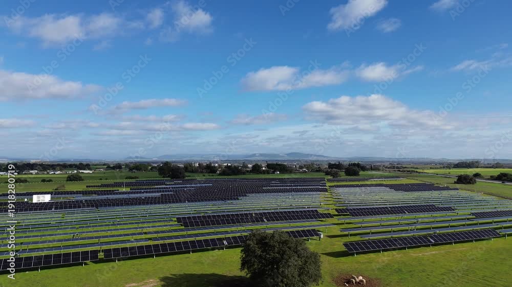 A cinematic 4K aerial drone video filmed in a solar farm in the ...