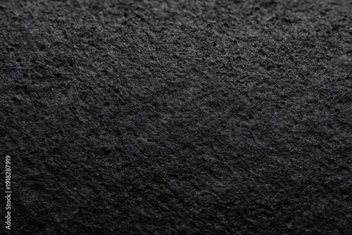 Natural black basalt or pumice stone texture with rough porous surface