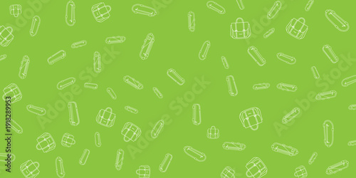 Pills and capsules scattered on a vibrant green background viewed from directly above