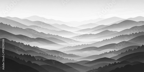 A misty morning view of snow-capped mountain peaks rising through thick clouds and valley fog during a serene blue dawn in the alpine wilderness