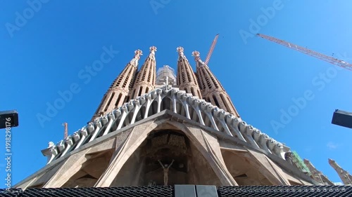  View of the Sagrada Familia's towers under construction against a clear blue sky at Barcelona 