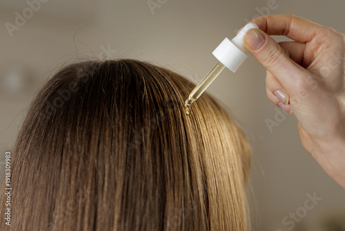 Photos Applying Hair Serum Dropper To Scalp For Hair Care Treatment