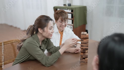 Wallpaper Mural Holiday concept of 4k Resolution. Group of Asian female friends playing games together at home. Fun and exciting leisure activities. Torontodigital.ca