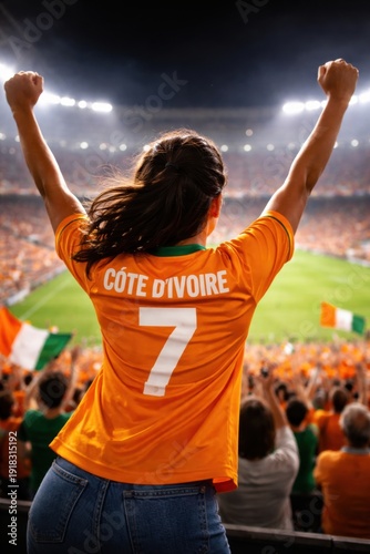Ivorian Female Soccer Fan Celebrating in Stadium