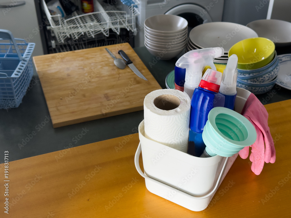 Fototapeta premium Different cleaning supplies in basket on table