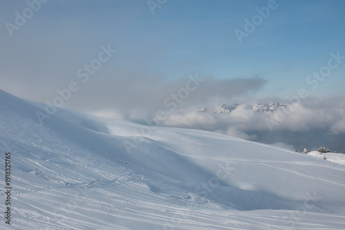 Wind shaped snow dunes in Swiss alpine winter