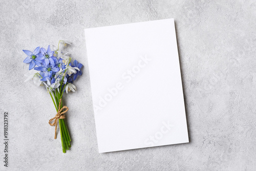 Fotografía Blank invitation or greeting card mockup placed on a textured gray surface besid