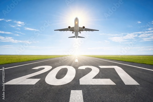 Airplane taking off from runway with 2027 marking symbolizing future travel and aviation growth