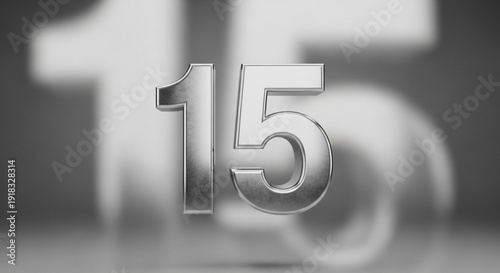 Silver number fifteen on blurred background metallic numeral 15 with reflective surface and subtle shadow effect