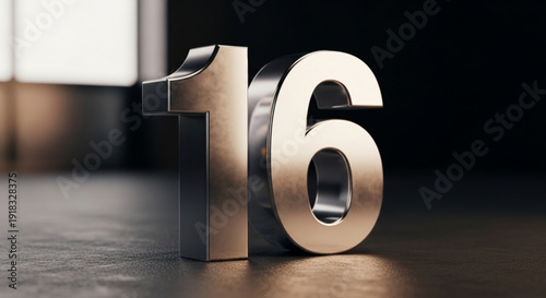 Shiny metallic number sixteen standing upright on a dark surface with soft lighting and blurred background