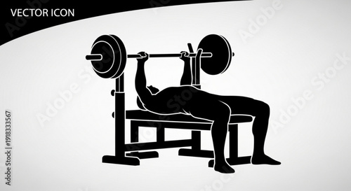 Man lifting weights on a bench press in a gym exercising fitness workout strength training muscle building