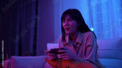 Wallpaper Mural Holiday concept of 4k Resolution. Asian woman playing games in the living room, she lost the game control and was upset. Torontodigital.ca