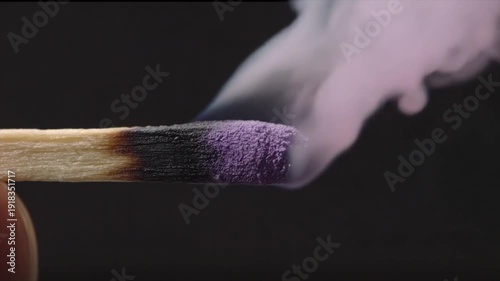 Wallpaper Mural Close-up of a wooden match head smoldering with purple tip and emitting smoky cloud Torontodigital.ca