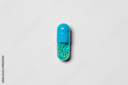 Amphetamine Salts XR 10mg Extended Release Capsule Isolated on transparent paper texture background, transparent shadow– ADHD Prescription Stimulant Medication Pharmaceutical Macro Studio Photography