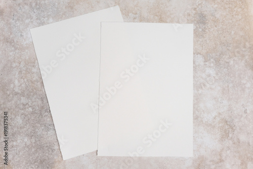 Konstfotografi Two sheets of blank watercolor paper mockup placed on a textured surface, showca