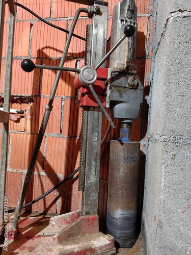 Diamond core drill machine mounted on a stand