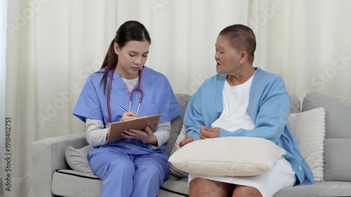 Female, nurse and tablet with senior patient for living assistance or healthcare in retirement home. Female, caregiver and listening to client with technology for elderly care in old age house.