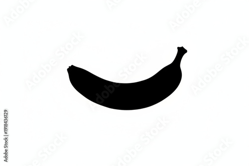 Banana Silhouette: A sleek, black silhouette of a ripe banana against a blank canvas, showcasing the fruit's elegant form.