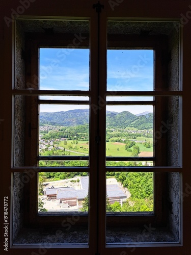 Cuadro en lienzo Scenic landscape view framed by a castle window windowpane