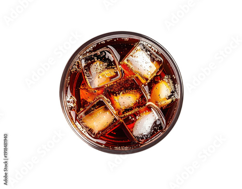 Overhead view of a bubbly, dark liquid drink with ice cubes in a glass
