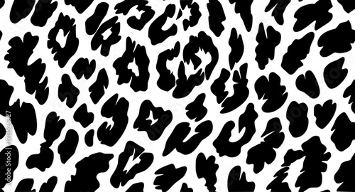 Seamless leopard skin texture pattern with orange floral ornaments and autumn leaf elements in a vector illustration for textile fabric design