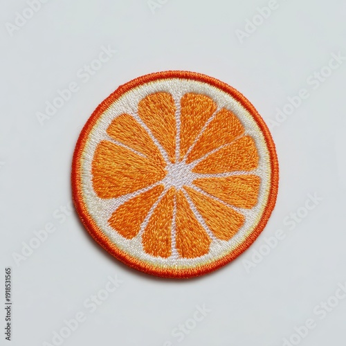 Embroidered circular orange slice patch with bright colors