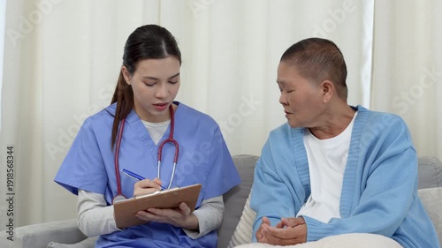 Female, nurse and tablet with senior patient for living assistance or healthcare in retirement home. Female, caregiver and listening to client with technology for elderly care in old age house.