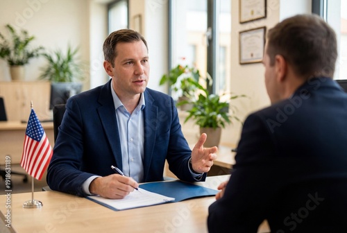 Professional man in a suit conducting a formal US immigration interview at a desk