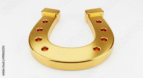Golden horseshoe with red gemstones on white background symbolizing good luck