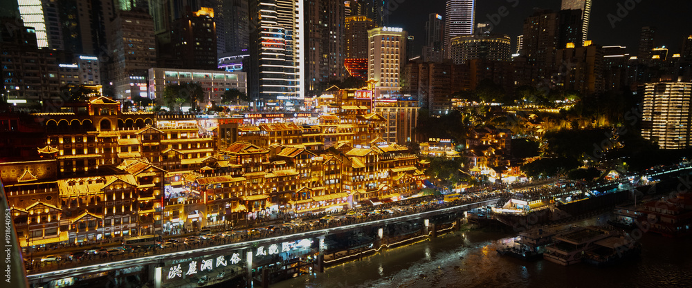 Fototapeta premium Panoramic view of Hongyadong caves in Chengdu, China, at night