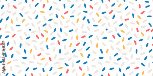Colorful confetti pattern with scattered elongated shapes on white