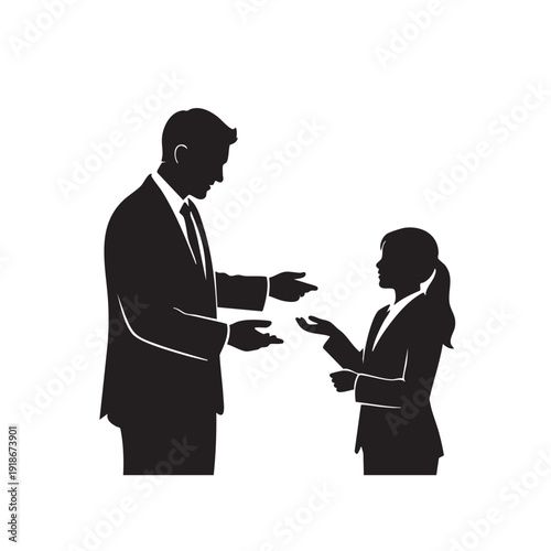 Business man in suit gesturing and talking to a smaller business woman, representing mentorship, career advice, or team briefing in a corporate setting.