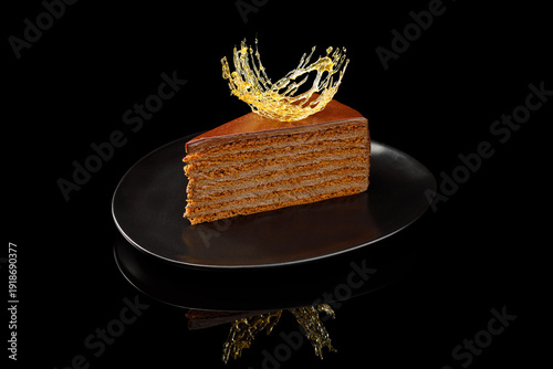 Layered honey cake slice with splash
