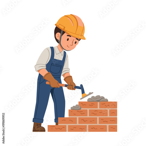 Construction worker applying mortar between bricks during bricklaying
