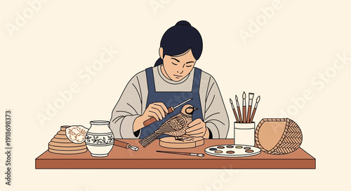 A person meticulously carving a wooden bird on a workbench, surrounded by art supplies and finished pottery.