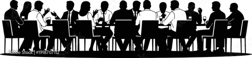 Silhouette of a large group of business professionals sitting at a long conference table during a formal corporate meeting or banquet.
