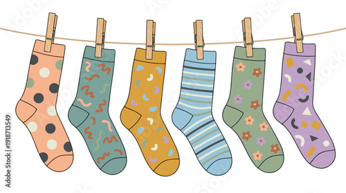 Colorful patterned socks hanging on a clothesline with clothespins