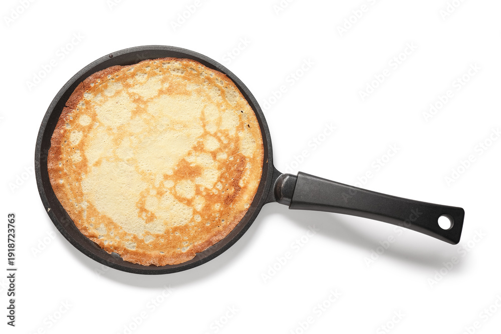 Fototapeta premium Frying pan with tasty thin pancake on white background