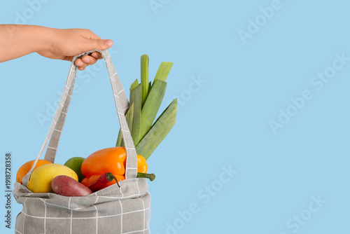 Female hand with vegetables...