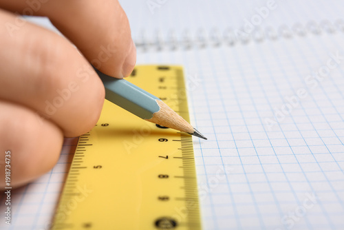 Female hand with pencil and...